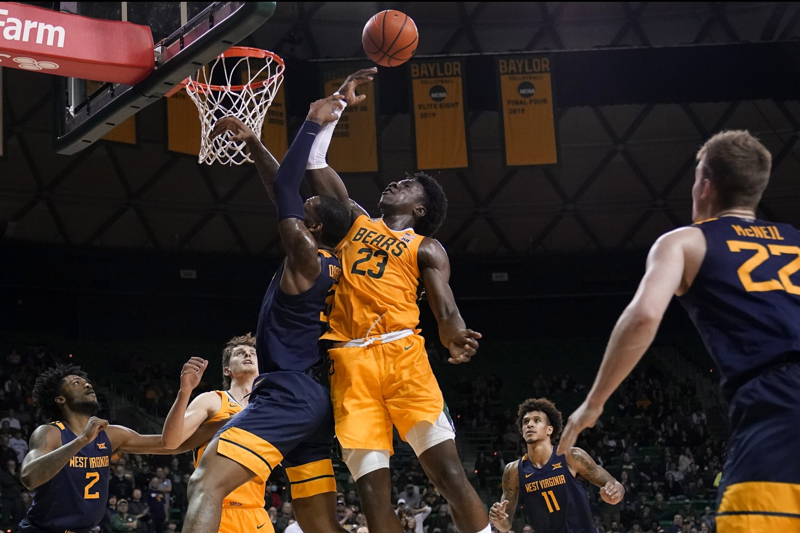 Taz Sherman gives a sign he's O.K. after taking a blow to the head; Bob Huggins unhappy with officiating after loss to Baylor